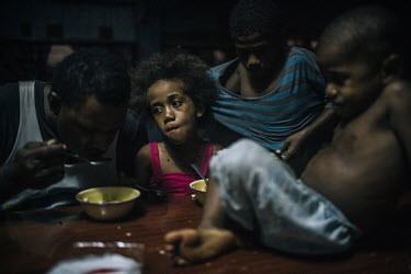 Children and their parents having dinner in an evacuation centre at the AKP Primary School in the town of Ba.  On 20 and 21 February 2016 the category 5 Severe Tropical Cyclone Winston hit Fiji, destr...