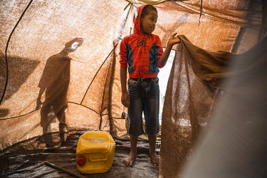 Ben (9) standing in the tent where his family took shelter after their home was destroyed by Cyclone Winston.   On 20 and 21 February 2016 the category 5 Severe Tropical Cyclone Winston hit Fiji, dest...