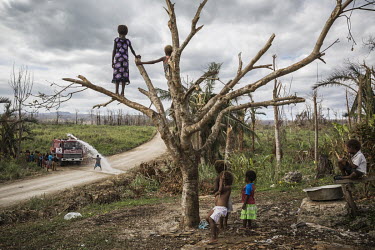 Children of Etas village on Efate Island watch a water truck delivering drinking water to their village. After Cyclone Pam hit Vanuatu in March 2015, many local communities were left without fresh wat...