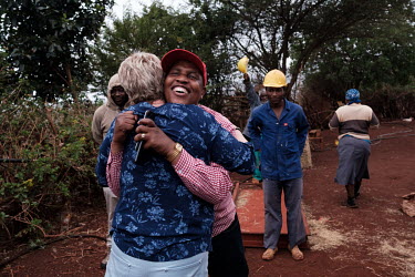 Goodwill Msibi thanking Thea Litschka-Koen after she and Bongani Bheki Myeni, a snake catcher she trained, caught a black mamba found in an outbuilding at Msibi's father's homestead in the village of...