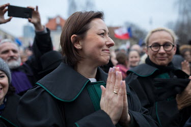 A Polish judge applauding the European judges attending the so-called 'March of a thousand robes', in support of Polish judges who are fighting a proposed new law that the government want to introduce...