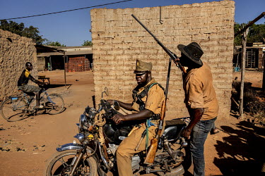 'Koglwegos', an armed self-defence militia group ,mostly made up of men from the Mossi ethnic group, patrolling in a village. In the absence of law and security the vigilante group, to the alarm of ma...