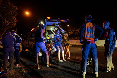 Paramedics treat motorbike riders and their pillion passengers for minor injuries they received after they skidded on oil on the road during Songkran festivities, when there is a spike in traffic acci...
