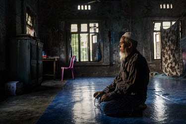 A Rohingya Muslim prays in one of the few undamaged mosques in Northern Rakhine.