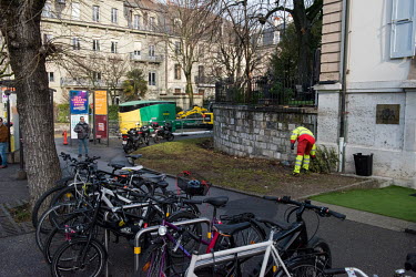 Collection of Christmas trees by a dedicated rubbish truck, searching the streets of Geneva for discarded trees. The trees are compacted in the truck and transferred to a site for burning with other c...