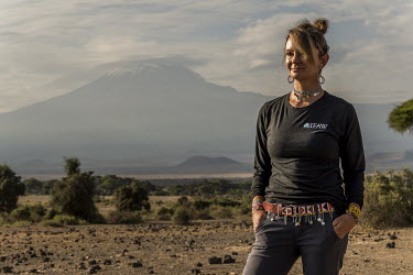 Faye Cuevas, standing in Amboseli National Park near Kilimanjaro, an anti-poaching investigator for the International Fund for Animal Welfare (IFAW), and a former lieutenant-colonel in US military int...