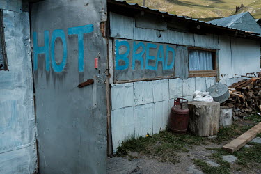 A sign advertising 'hot bread' at the Shiois Stonehouse Hostel.