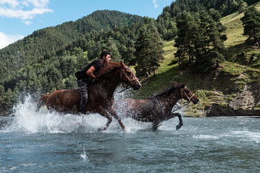 A bareback horserace through the Alazani River is a highlight of the traditional Khitanoba festival in the village of Jvarboseli.