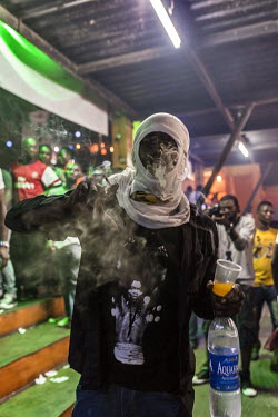 A man obscured by smoke at the New Afrika Shrine during the annual Felabration music festival which celebrates Afrobeat and its foremost exponent Fela Anikulapo Kuti.
