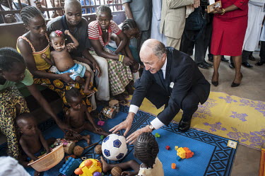 French Minister of Foreign Affairs, Laurent Fabius, at a nutrition centre at a hospital during a visit to Bangui.