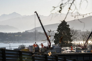 United Nations Office Geneva, Strategic Heritage Plan View of construction of the new building at the eastern end of the Palais des Nations site, with the lake and Alps behind, including Mont Blanc at...