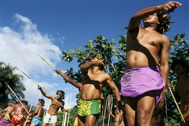 Men throw javelins during the Feast of Heiva which brings together all the traditional arts and sports of Polynesia.