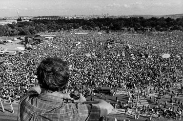 A man looks out over a rally in Letna Park which drew a crowd of a quarter of a million people, the biggest protest since the end of the communist-era. The crowd were demanding the resignation of Prim...