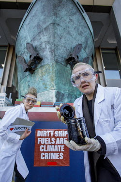 Women dressed as scientists protesting outside the International Maritime Organisation (IMO) against the use and carriage of Heavy Fuel Oil (HFO) by ships in Arctic waters.  Heavy fuel oil (HFO) is an...