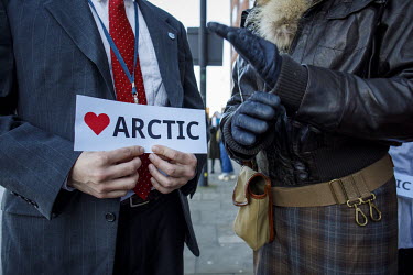 A man holds a 'Love Arctic' sign during a protest outside the International Maritime Organisation (IMO) against the use and carriage of Heavy Fuel Oil (HFO) by ships in Arctic waters.  Heavy fuel oil...