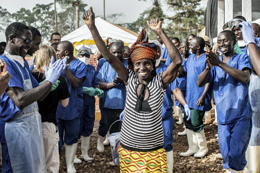 Vani Zoumanigui (40) celebrates, along with staff, as she is the first Ebola positive patient to recover and be allowed to leave the Ebola Treatment Centre (CTE) managed by Alima.  ''I'm very happy, t...