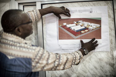 Alexis Reouhiri Dermbaye (42) from Chad, looks at a diagram of an Ebola Treatment Centre (CTE). He is the founding member and general coordinator of the Chadian NGO 'Health Alert' and has joined a tea...