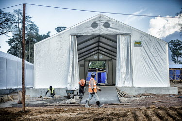 Construction workers prepare an Ebola virus treatment centre (CTE).