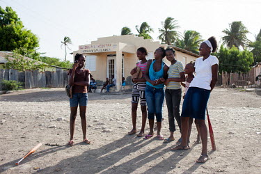 Elvira Pantaleon (18, white top) playing a softball game with friends in Batey No.1, near Tamayo. A 2013 ruling by the Dominican Constitutional Court made thousands stateless. It was particularly aime...