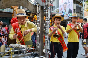 Musicians take part in annual celebrations in front of the Qingshan Temple, one of Taipei's oldest sacred sites, located in the city's Wanhua District. Established in 1856, it is believed the God of t...