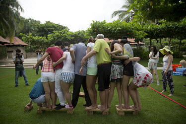 Members of Diamond Love, a high-end dating service, take part in games during a weekend retreat where men and women spend time meeting and getting to know prospective partners.