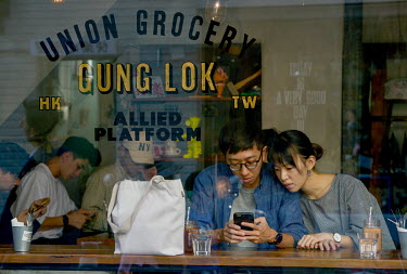 Customers inside the popular Hong Kong-style Gung Lok cafe on Taipei's Chifeng Street.