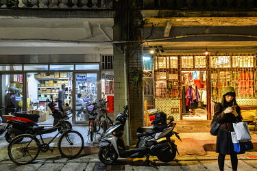 An engineering workshop beside a trendy fashion outlet on Chifeng Street.