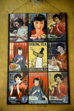 Old advertising posters for Formosa-Oolong tea displayed inside The Formosa Black Tea Co., once a factory and tea exporting station, now a museum.
