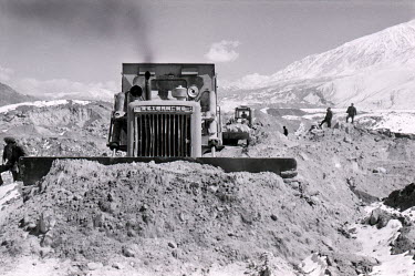 Work crews, dressed in Mao suits, helping to construct the Karakoram Highway on the first year the crossing was opened to foreign travellers.