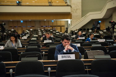 Diplomats sitting carefully apart at the United Nations Human Rights Council on the day it was announced that the council will abandon its present session due to the Coronavirus, following on from the...