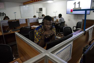 A call centre worker takes an emergency call on the Ebola hotline.