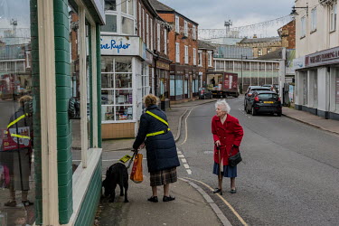 Pensioners, one of whom is walking with a guide dog, stop to talk in the old Fenland market town of Spalding.  In the 2016 referendum on Britain's membership of the EU, the South Holland district prod...