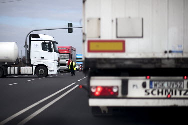 Trucks queue in a holding area on the border between Germany and Poland. As coronavirus control measures are put in place at borders traffic crossing from Germany to Poland has built up and come to a...