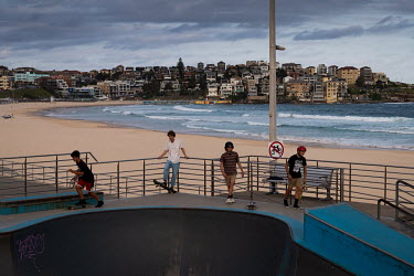 Youths skateboarding at a park near the now deserted Bondi Beach. Australian officials closed Sydney's iconic Bondi Beach on Saturday 21 March 2020, after thousands of people flocked there in recent d...