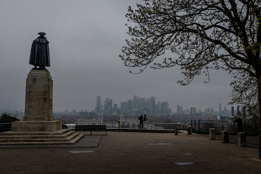 A couple look over London from the Greenwich Royal Observatory, almost deserted as people stayed away from tourist landmarks and worked from home in response to government recommendations introduced t...