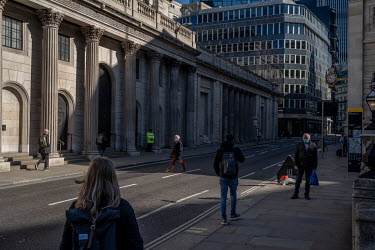 The Bank of England (left) on Threadneedle Street in the City of London. It was the day that the coronavirus lockdown was introduced by the government following reports of people ignoring its advice o...