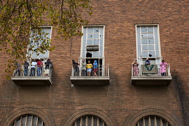 Residents of an abandoned building in Hillbrow get some fresh air on its balconies during the coronavirus lockdown.
