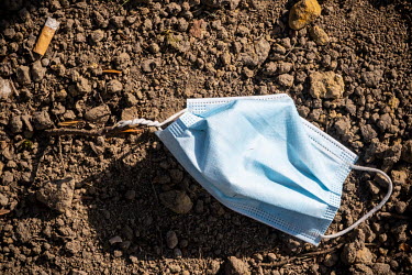 A discarded face mask on the ground near the Brugmann University Hospital.  Following the spread of the coronavirus around many European countries, people have started wearing face masks and rubber gl...