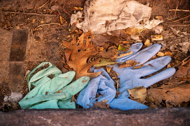 Discarded rubber gloves on the ground near the Brugmann University Hospital.  Following the spread of the coronavirus around many European countries, people have started wearing face masks and rubber...
