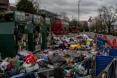 Overflowing clothing donations and items for recycling at a supermarket in North London. Many recycling centres have been closed because of the coronavirus lockdown.