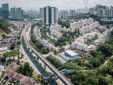 An aerial view of a residential district of Kuala Lumpur with empty roads due to the Movement Control Order (MCO), a government ruling that forbids all public travel for reasons other than purchasing...