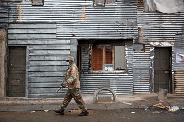 A member of the South African Defence Forces patrolling in Alexandra Township to try and enforce the coronavirus lockdown. Alexandra is one of the most densely populated areas in Johannesburg. It has...