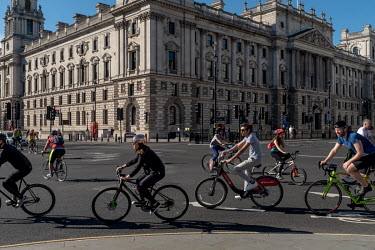 Cyclists in Parliament Square during the coronavirus lockdown. In early April 2020, the Health Minister Matt Hancock, threatened to stop people from exercising outside after reports that many people w...