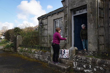 Volunteer Lesley Leeson delivers shopping to Madeline, an elderly Rothbury resident. The town has a significant elderly population but its the community has rallied around to ensure that residents hav...