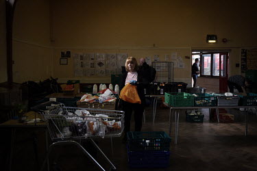 Volunteers prepare food parcels for people in need who are attending the Newcastle West End Foodbank. The West End Foodbank feeds more than 3000 people each month and has had to adapt its layout and s...