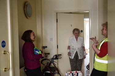 Audrey, an elderly Rothbury resident, receives a delivery of shopping from community volunteers Lesley Leeson and Vikki Gwen. The town has a significant elderly population but its the community has ra...