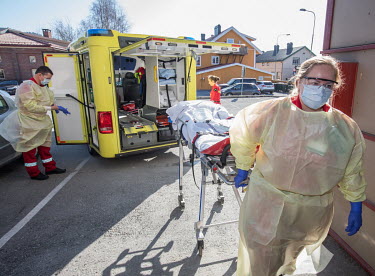 Paramedics in the city of Drammen put on personal protective equipment (PPE) in order to transport patients during the coronavirus lockdown.