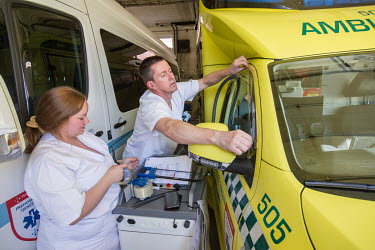 An ambulance is sealed up during a coronavirus decontamination process.