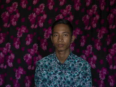 Sai Lin Thu (21) wearing a shirt that sells for GBP 24.50 (Euro 27.99) at Dutch clothing retailer We. He works in a factory that makes clothes for western brands including We. Sai Lin Thu lives in a h...