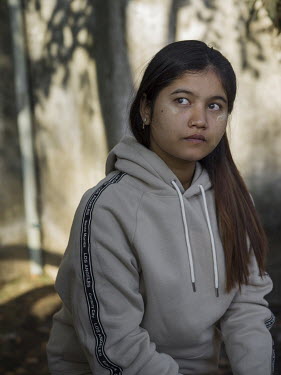 War War Aung (23) wearing a track suit that sells at H&M for GBP 43.65 (Euro 49.98). She works in a garment factory that produces clothes for brands including H&M. War War Aung lives in a hostel with...